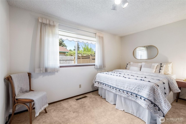 1102 S Villard St, Tacoma, WA 98465 - carpeted bedroom with a textured ceiling and baseboards