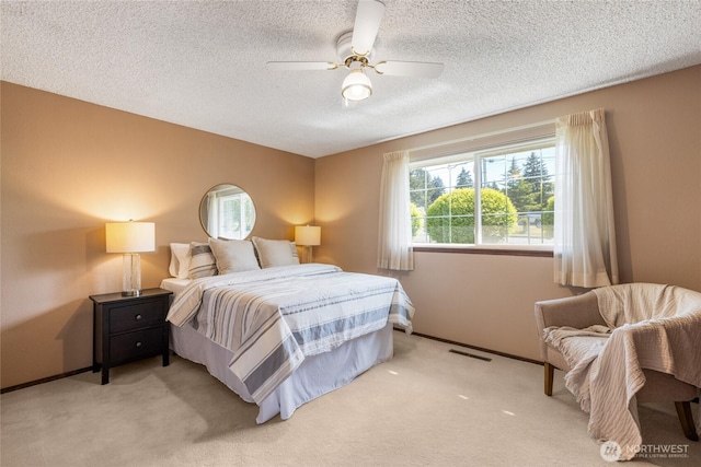 1102 S Villard St, Tacoma, WA 98465 - bedroom featuring carpet floors, a textured ceiling, a ceiling fan, and baseboards