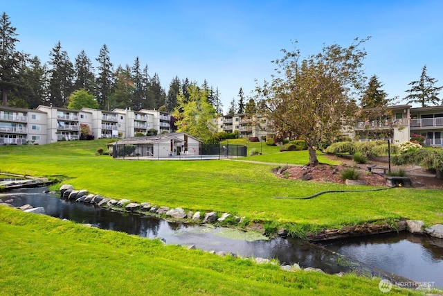 view of property's community with a lawn