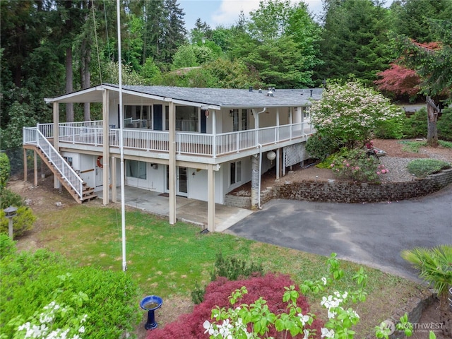2419 Rocky Point Rd NW, Bremerton, WA 98312 - back of house featuring a patio, a deck, stairway, a yard, and roof with shingles