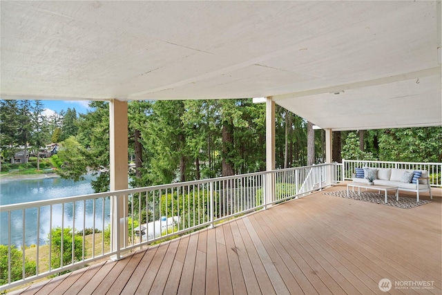 2419 Rocky Point Rd NW, Bremerton, WA 98312 - deck with an outdoor hangout area, a water view, and view of wooded area
