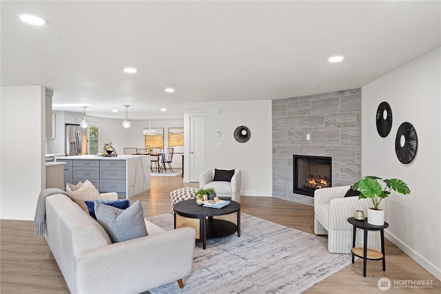 2419 Rocky Point Rd NW, Bremerton, WA 98312 - living area with recessed lighting, a fireplace, light wood finished floors, and baseboards