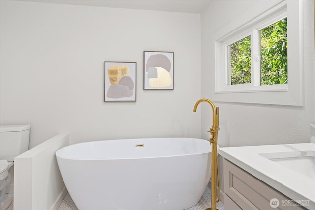 2419 Rocky Point Rd NW, Bremerton, WA 98312 - bathroom featuring toilet, a freestanding bath, and vanity