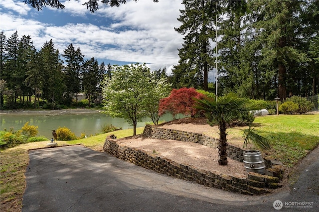 2419 Rocky Point Rd NW, Bremerton, WA 98312 - view of community featuring a patio area, a water view, and a lawn