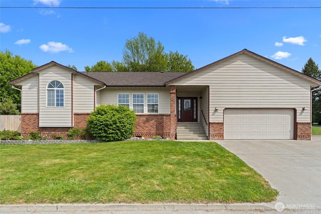 995 S Miner St, Colville, WA 99114 - single story home featuring brick siding, an attached garage, a front lawn, and concrete driveway