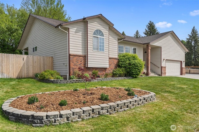 995 S Miner St, Colville, WA 99114 - view of front of property featuring brick siding, an attached garage, and concrete driveway