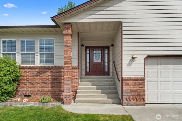 995 S Miner St, Colville, WA 99114 - property entrance with brick siding and an attached garage