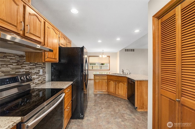 995 S Miner St, Colville, WA 99114 - kitchen with electric range, black dishwasher, under cabinet range hood, a sink, and decorative backsplash