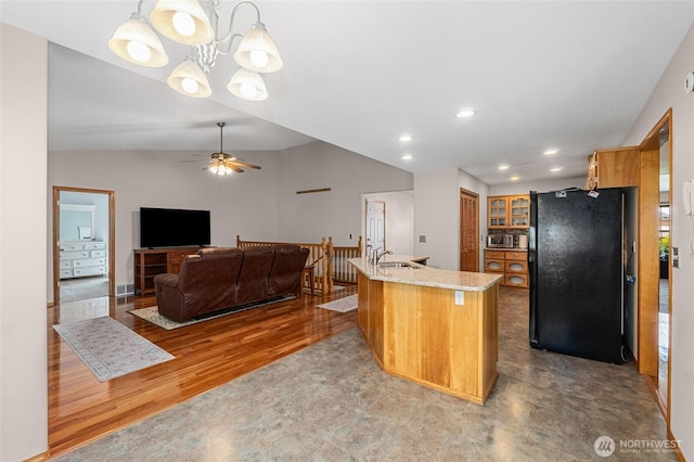 995 S Miner St, Colville, WA 99114 - kitchen with freestanding refrigerator, a sink, ceiling fan, light stone counters, and light wood finished floors