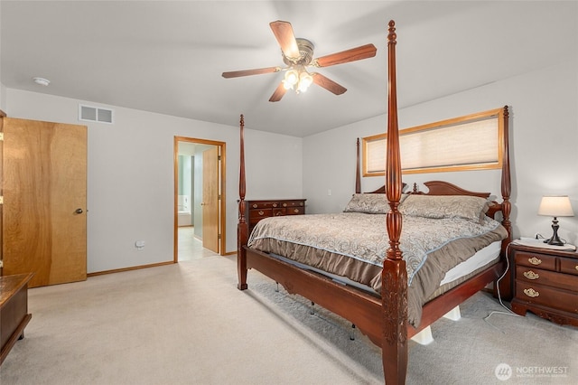 995 S Miner St, Colville, WA 99114 - bedroom with light colored carpet, a ceiling fan, ensuite bathroom, and baseboards