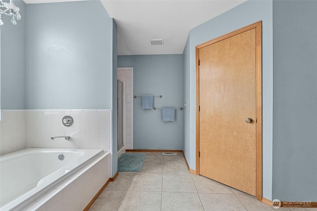 995 S Miner St, Colville, WA 99114 - full bathroom with a garden tub, a shower stall, baseboards, and tile patterned flooring