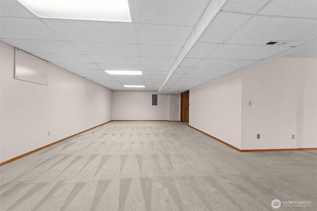 995 S Miner St, Colville, WA 99114 - finished below grade area featuring light colored carpet, baseboards, a paneled ceiling, and electric panel