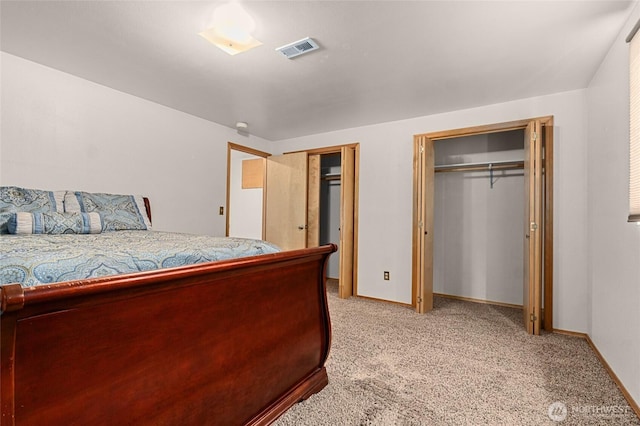 995 S Miner St, Colville, WA 99114 - bedroom featuring two closets, light carpet, and baseboards