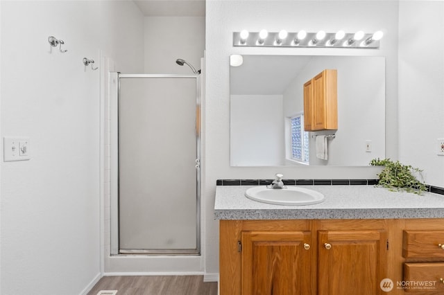 5211 S Aspen, Spokane, WA 99224 - full bath with a shower stall, vanity, and wood finished floors