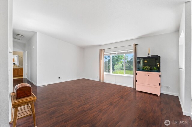 5211 S Aspen, Spokane, WA 99224 - unfurnished living room featuring wood finished floors and baseboards