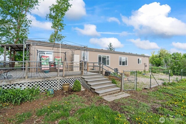 5211 S Aspen, Spokane, WA 99224 - view of front of house with a wooden deck and fence