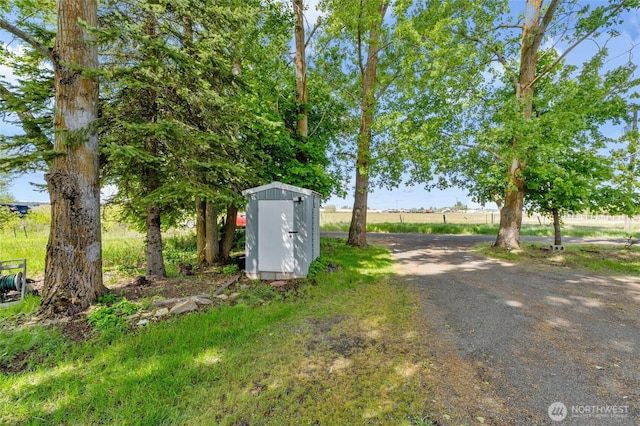 5211 S Aspen, Spokane, WA 99224 - view of yard with a storage unit and an outbuilding