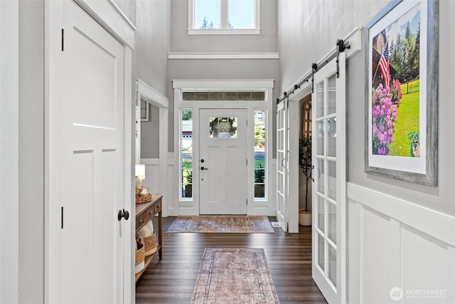 191 E Sterling Dr, Allyn, WA 98524 - foyer with a towering ceiling, dark wood-style floors, and a barn door