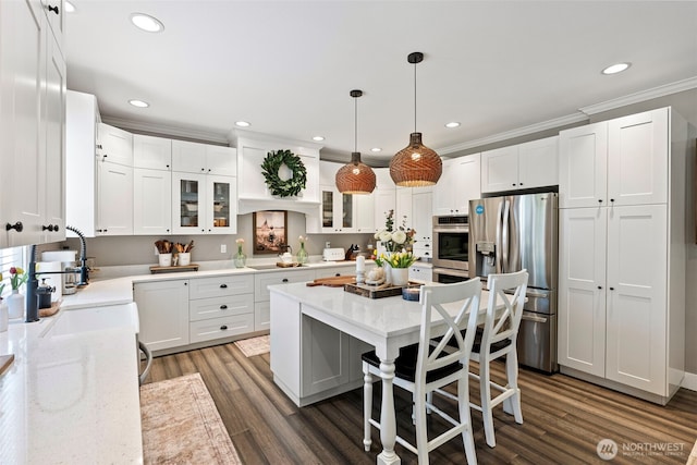 191 E Sterling Dr, Allyn, WA 98524 - kitchen featuring appliances with stainless steel finishes, recessed lighting, white cabinetry, dark wood-style floors, and glass insert cabinets