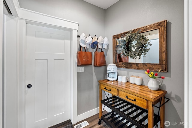 191 E Sterling Dr, Allyn, WA 98524 - doorway featuring baseboards and wood finished floors