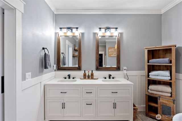 191 E Sterling Dr, Allyn, WA 98524 - full bathroom with crown molding, double vanity, and wainscoting