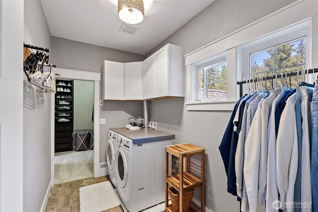 191 E Sterling Dr, Allyn, WA 98524 - laundry area featuring cabinet space, washer and dryer, and baseboards