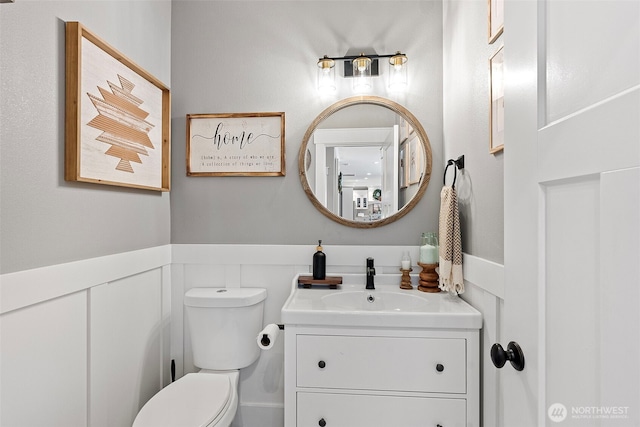 191 E Sterling Dr, Allyn, WA 98524 - bathroom with wainscoting, toilet, and vanity
