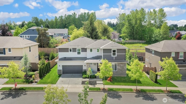 28611 NE 155th St, Duvall, WA 98019 - view of front of house featuring stone siding, a residential view, concrete driveway, and a garage