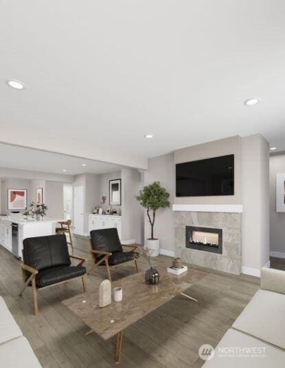 13214 NE 127th Ct Unit E, Kirkland, WA 98034 - living area with a fireplace, wood finished floors, recessed lighting, and baseboards