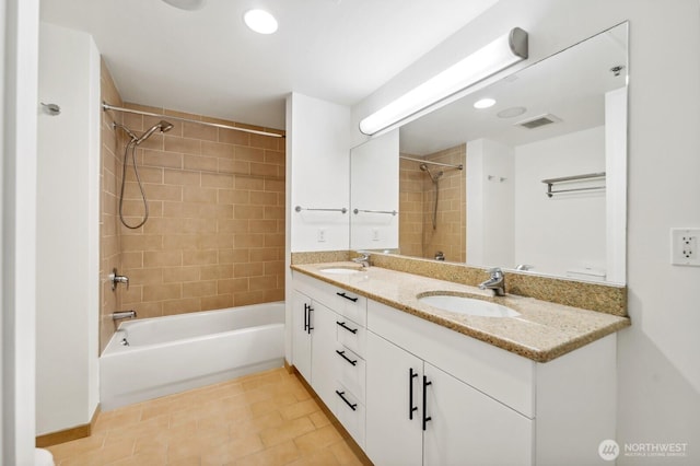 full bathroom with washtub / shower combination, double vanity, and recessed lighting