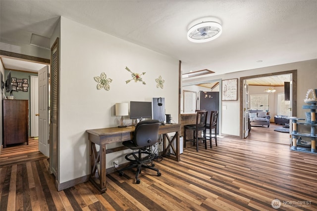 office area with wood finished floors and baseboards