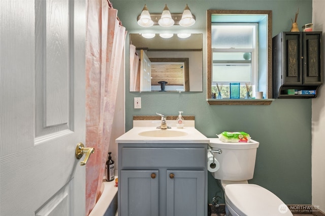 full bath featuring toilet and vanity