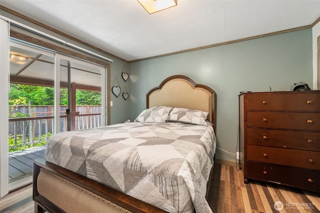bedroom with access to outside, ornamental molding, light wood-type flooring, and baseboards