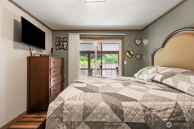 bedroom with wood finished floors, access to exterior, ornamental molding, and baseboards