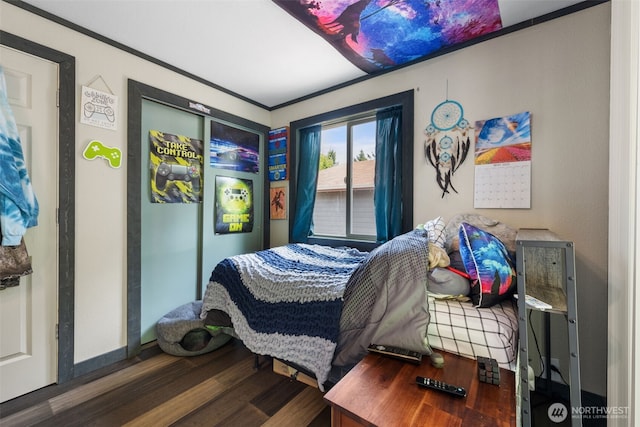 bedroom featuring wood finished floors