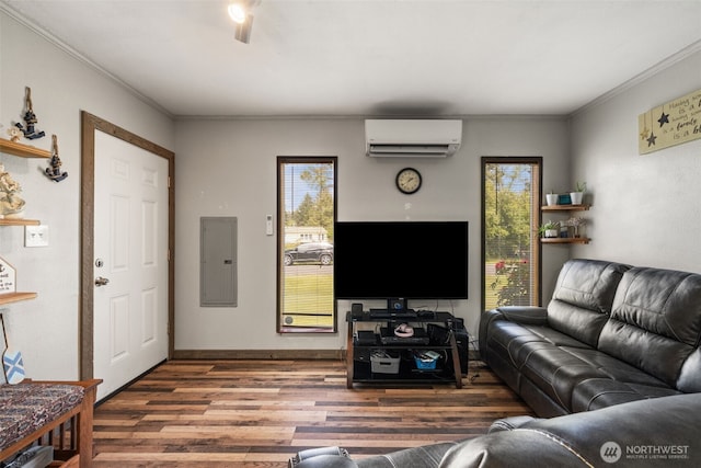 living room with a wall mounted air conditioner, electric panel, crown molding, and wood finished floors