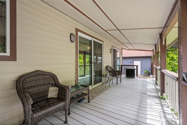 wooden terrace with a porch