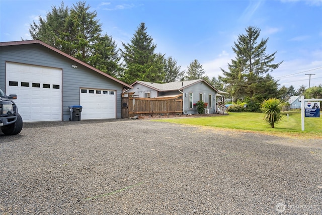 view of front of home with a detached garage