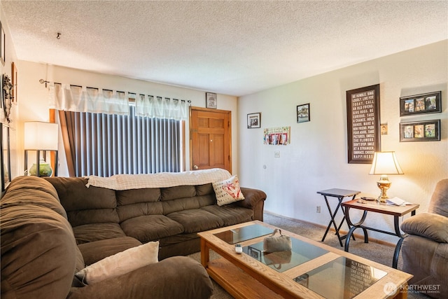 1016 Oak, Kelso, WA 98626 - carpeted living area with a textured ceiling and baseboards