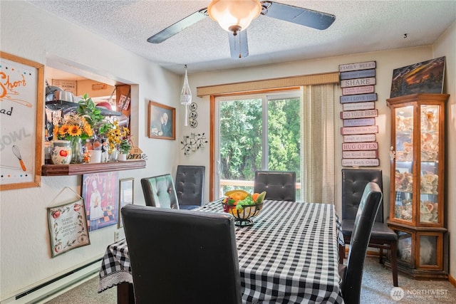 1016 Oak, Kelso, WA 98626 - dining room with a textured ceiling, carpet flooring, a ceiling fan, and baseboard heating