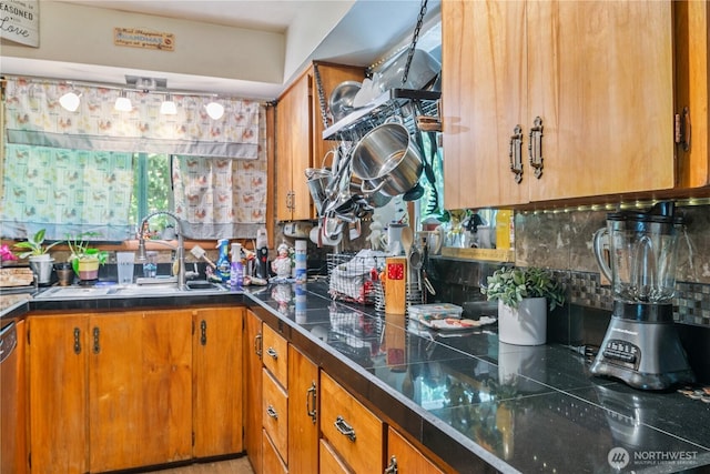 1016 Oak, Kelso, WA 98626 - kitchen with a sink, brown cabinets, decorative backsplash, stainless steel dishwasher, and tile countertops