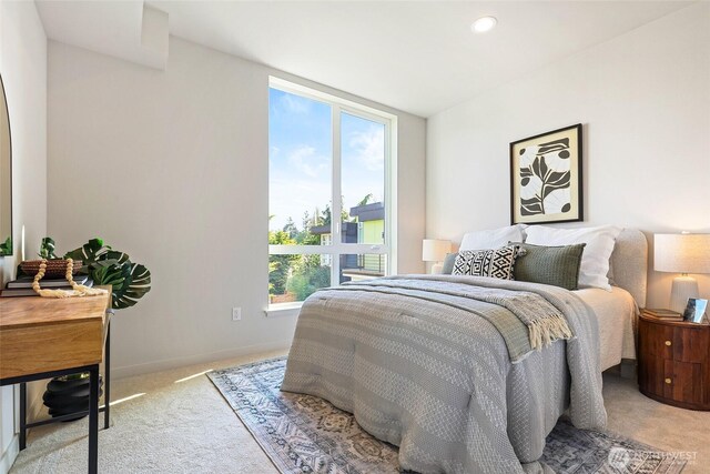 9752A Holman Rd NW, Seattle, WA 98117 - bedroom with multiple windows and light carpet
