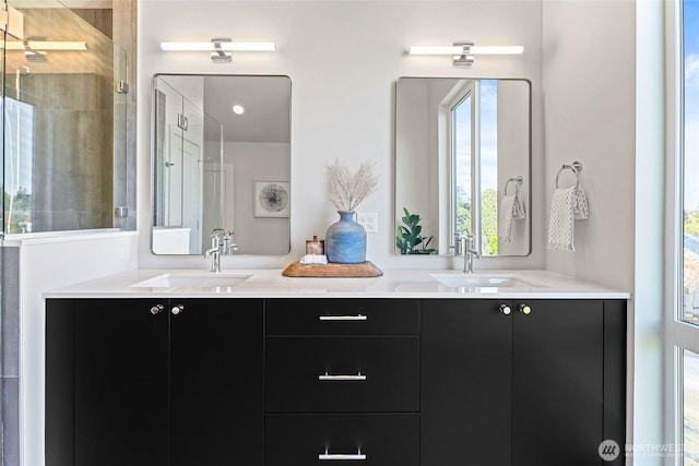 9752A Holman Rd NW, Seattle, WA 98117 - bathroom featuring double vanity and a tile shower