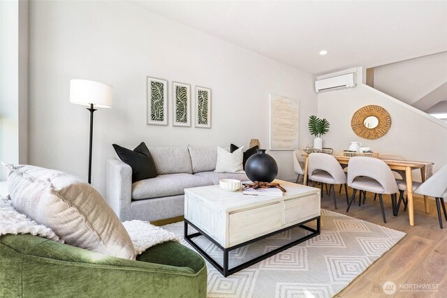 9752A Holman Rd NW, Seattle, WA 98117 - living room with a wall mounted AC, wood finished floors, and recessed lighting