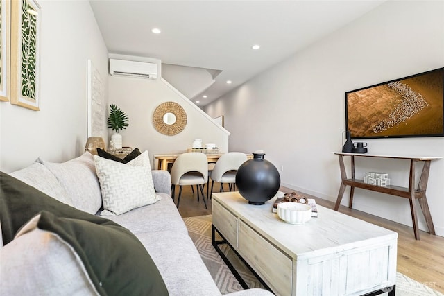 9752A Holman Rd NW, Seattle, WA 98117 - living area featuring a wall unit AC, wood finished floors, recessed lighting, stairs, and baseboards