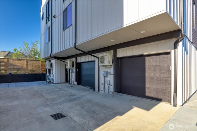 9752A Holman Rd NW, Seattle, WA 98117 - garage with a cooling unit, driveway, and fence