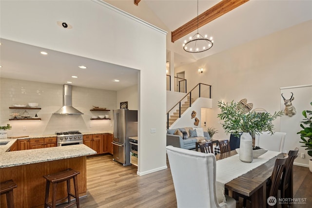 60 Spruce Ln, Ronald, WA 98940 - dining area with high vaulted ceiling, light wood finished floors, stairway, a chandelier, and recessed lighting
