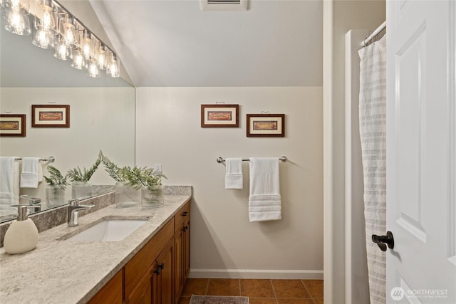 60 Spruce Ln, Ronald, WA 98940 - bathroom featuring vaulted ceiling, vanity, baseboards, and tile patterned flooring