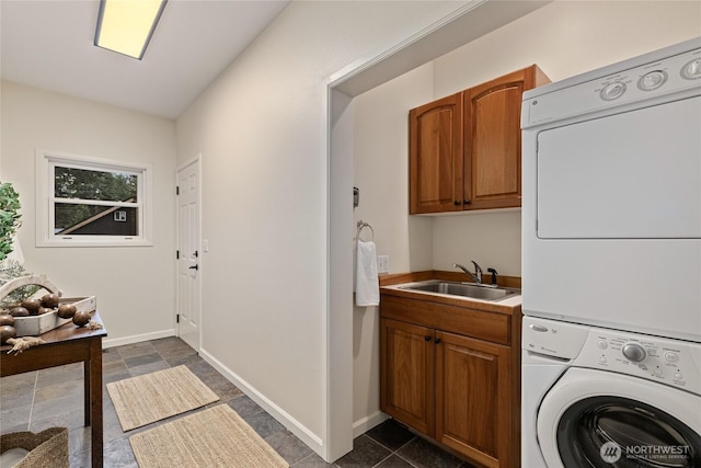 60 Spruce Ln, Ronald, WA 98940 - clothes washing area with stacked washer and clothes dryer, cabinet space, and baseboards