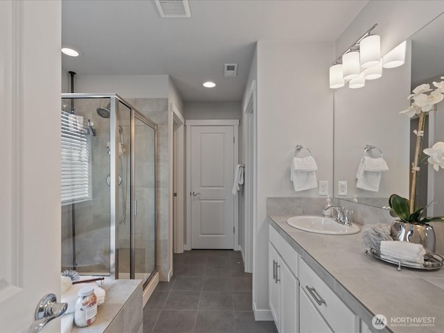 bathroom with tile patterned floors, a stall shower, recessed lighting, vanity, and baseboards